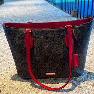 PRE-LOVED , Calvin Klein Women purse. Color: Brown & Red.